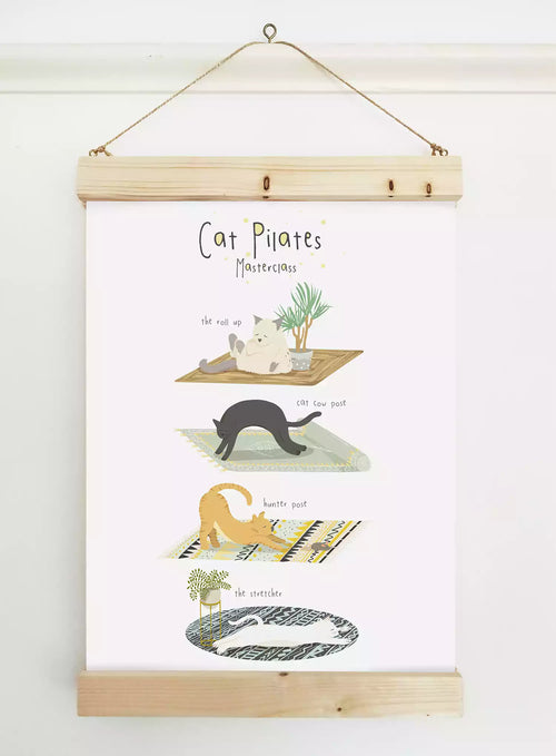 Illustrated print with text 'Cat Pilates' and funny cats in different poses, like 'cat cow'.