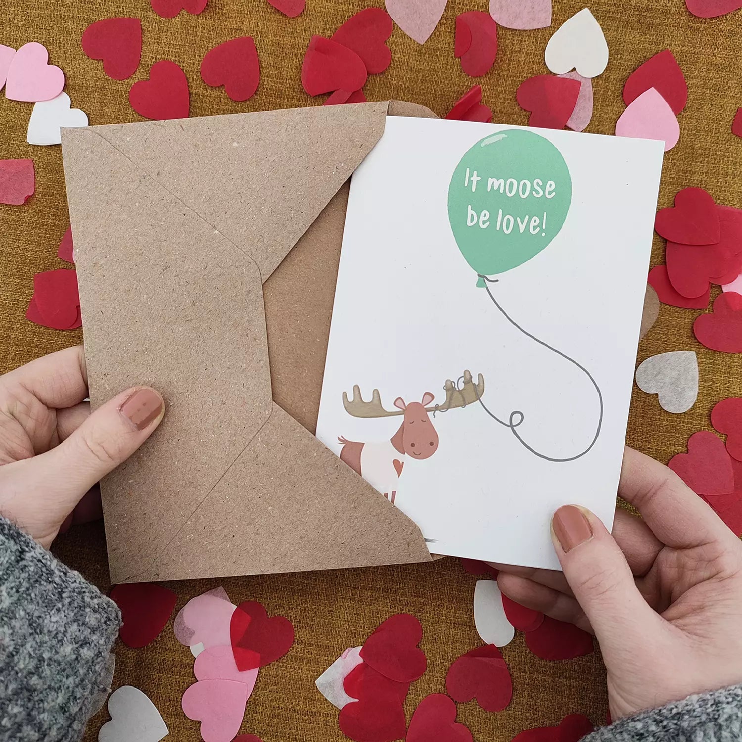 funny pun card with moose and ballon, inside reads 'it moose be love!'