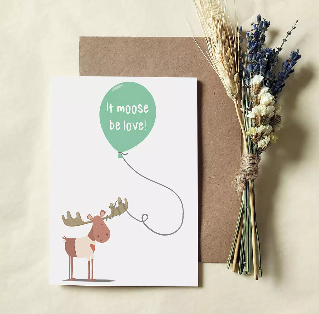 funny pun card with moose and ballon, inside reads 'it moose be love!'