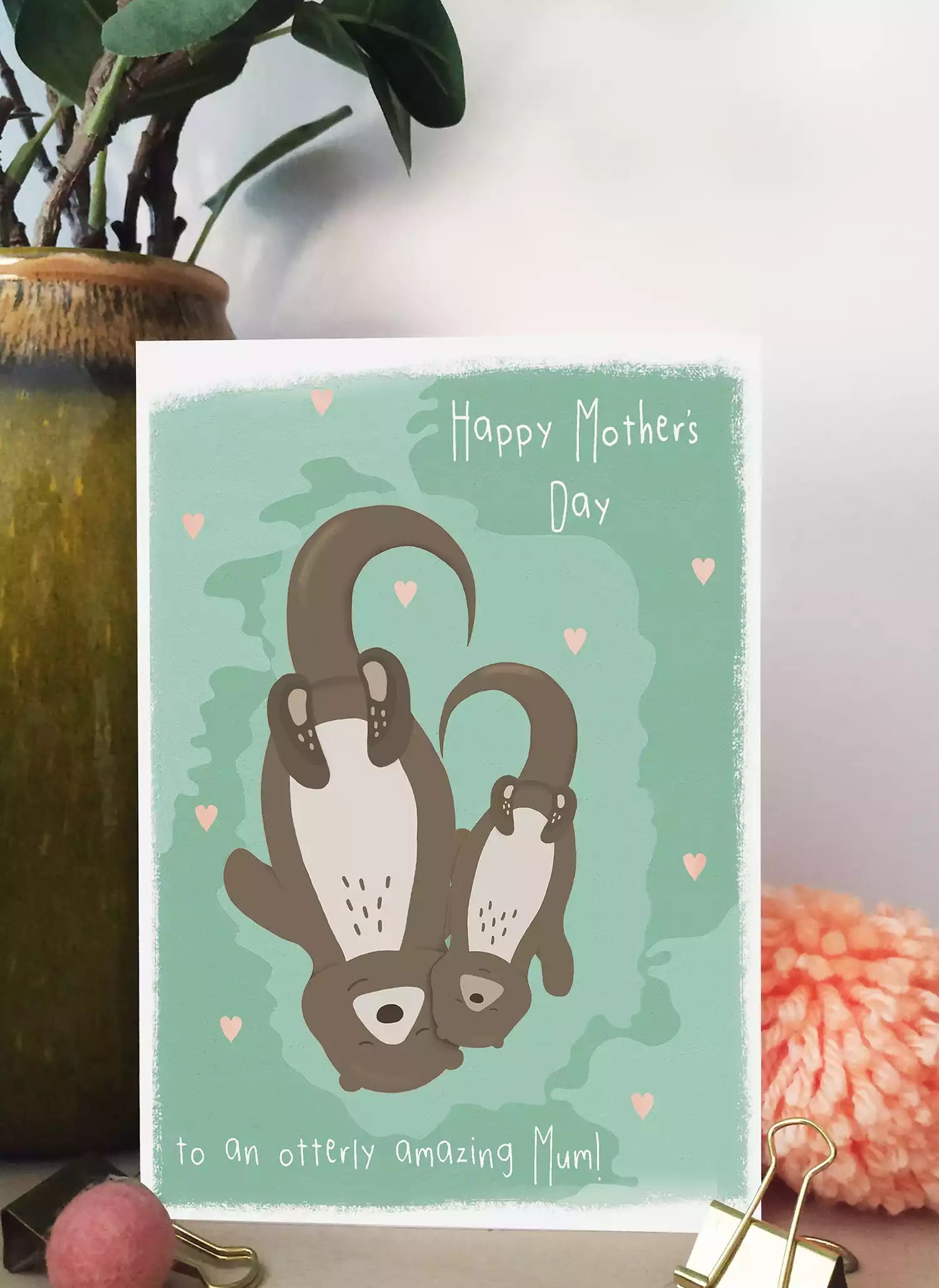 mother's day card with mum and baby otter and pun 'to an otterly amazing mum'
