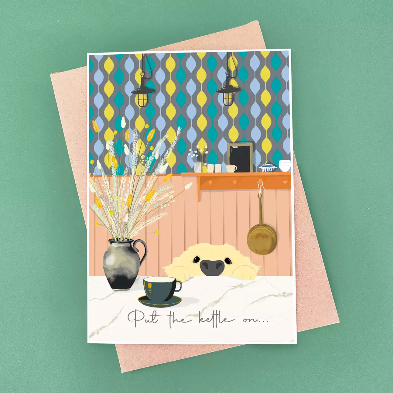 new home card with dog and text 'put the kettle on' on a patterned wallpaper background