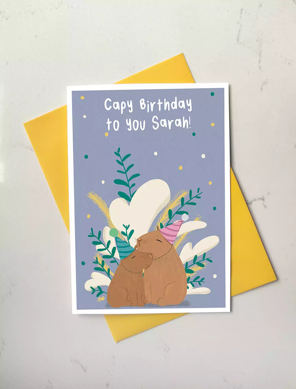 birthday card with two capybaras and pun 'capy birthday to you!'