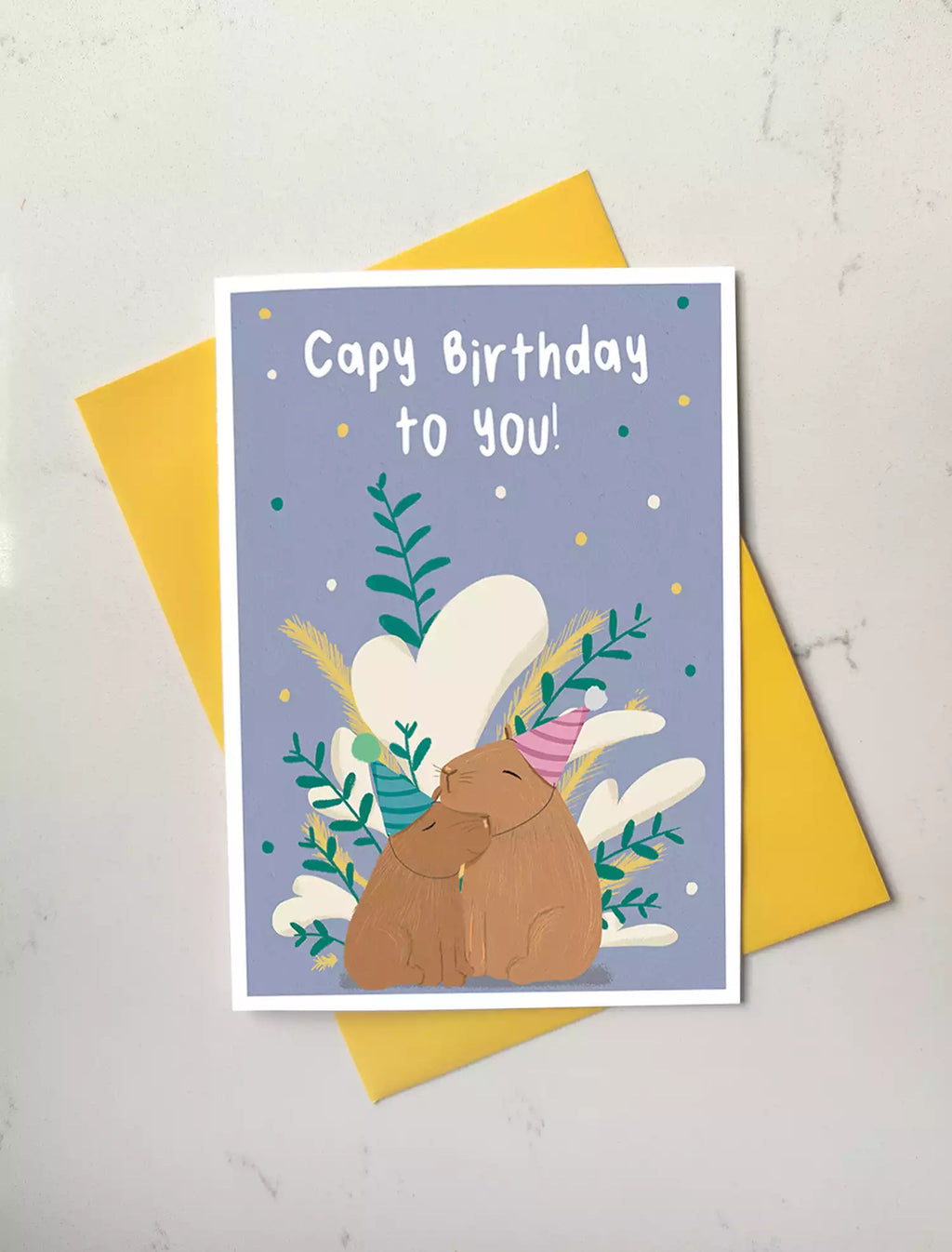 birthday card with two capybaras and pun 'capy birthday to you!'