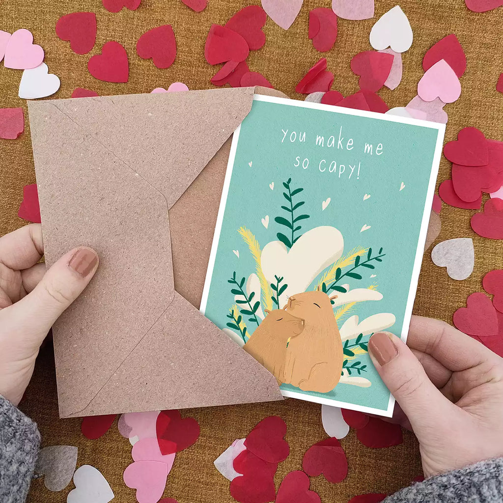 capybaras hugging love card, text 'you make me so capy'