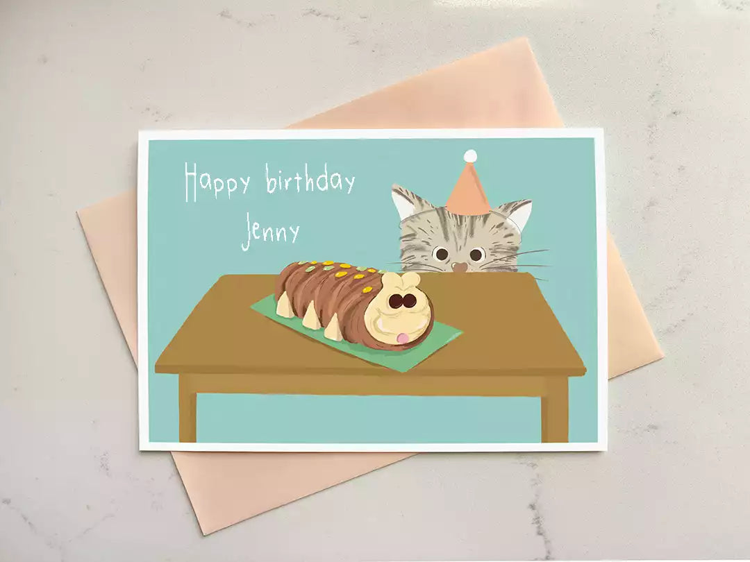 personalised birthday card featuring a cat looking up at a caterpillar cake.