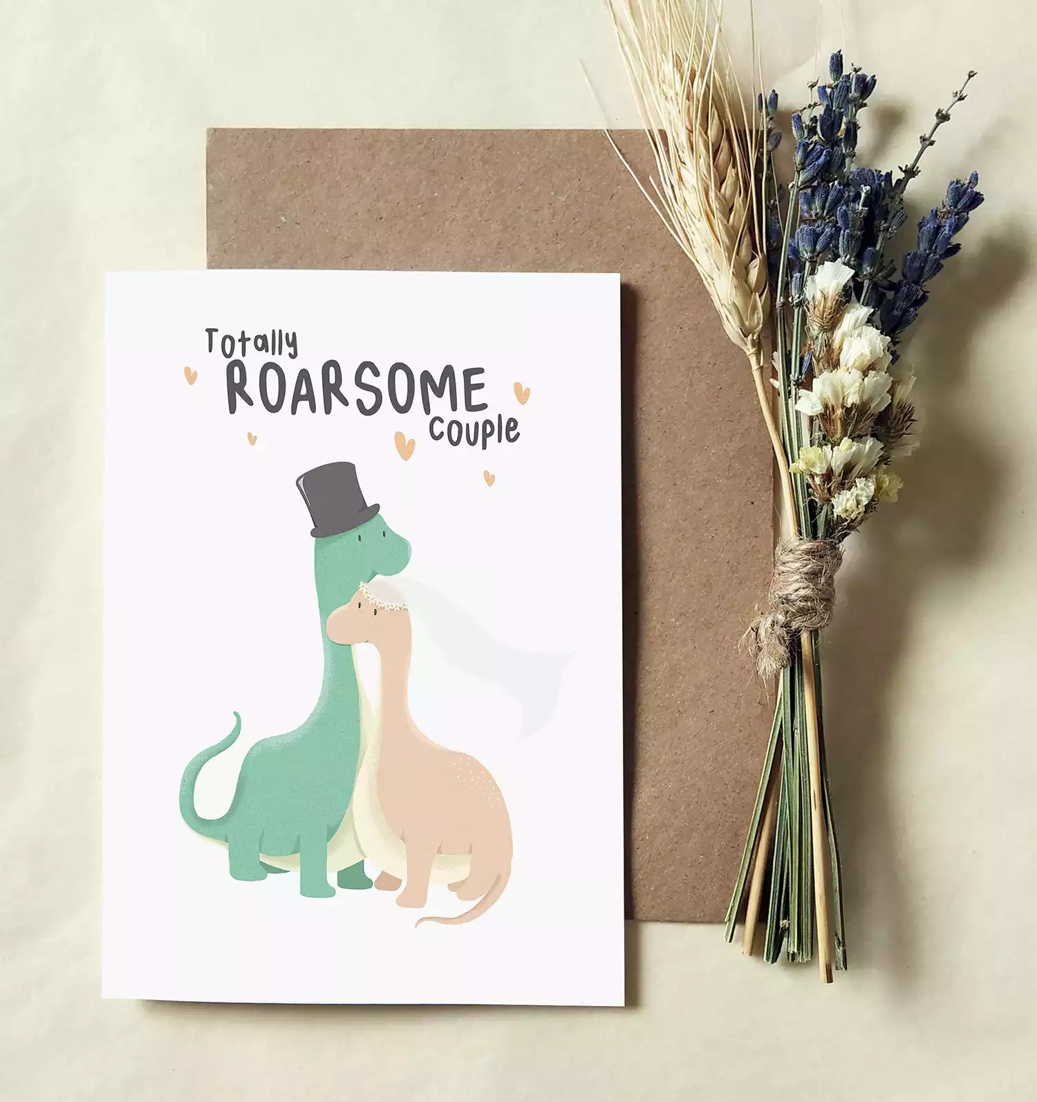 dinosaur wedding card with text 'totally roarsome couple' and personalised with couple's names