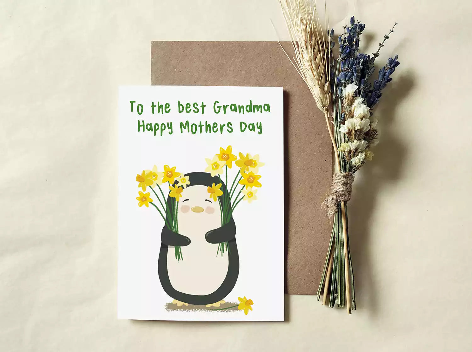 penguin holding daffodils and text 'to the best grandma happy mothers day'