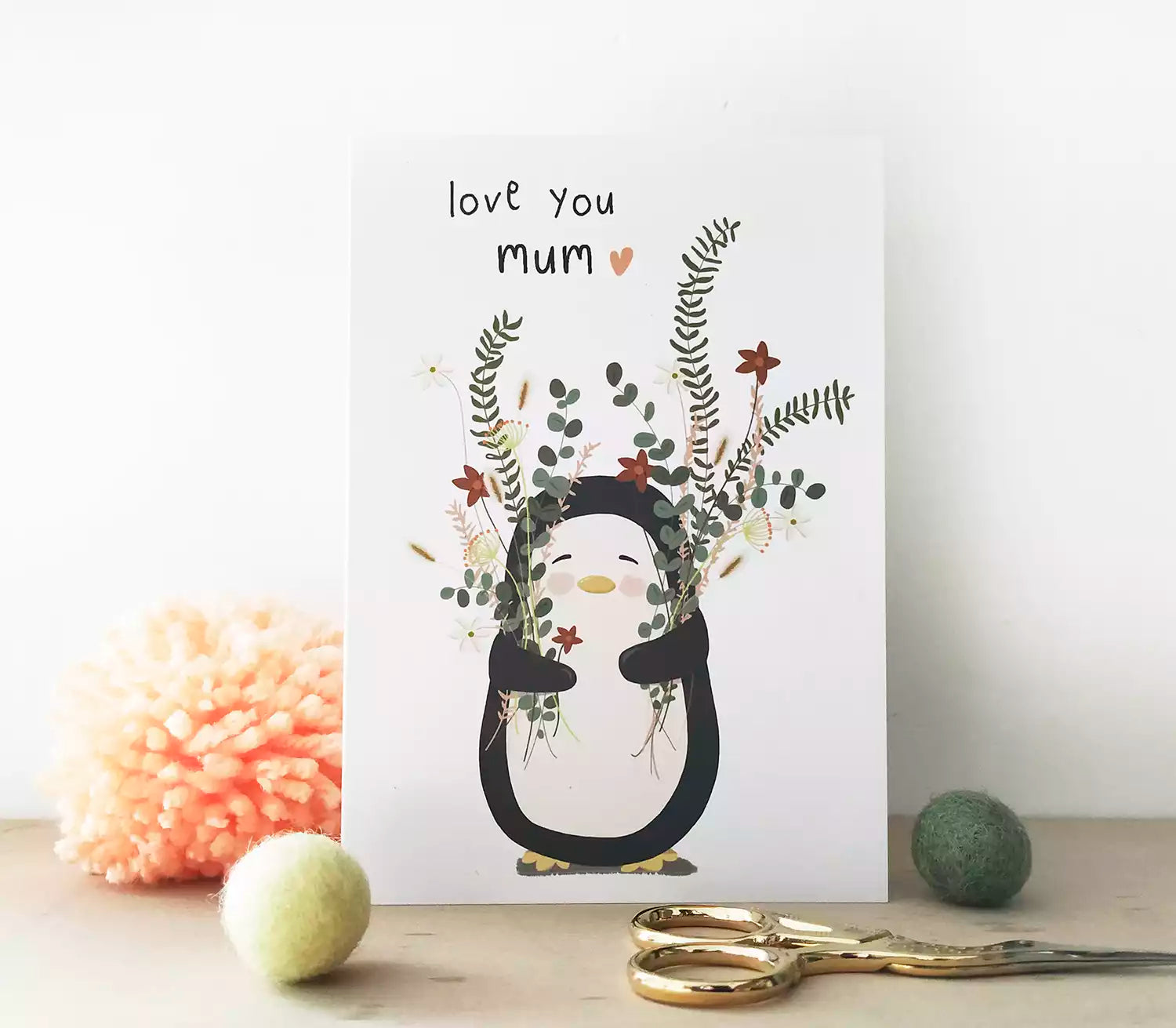 penguin holding flowers and caption 'love you mum'