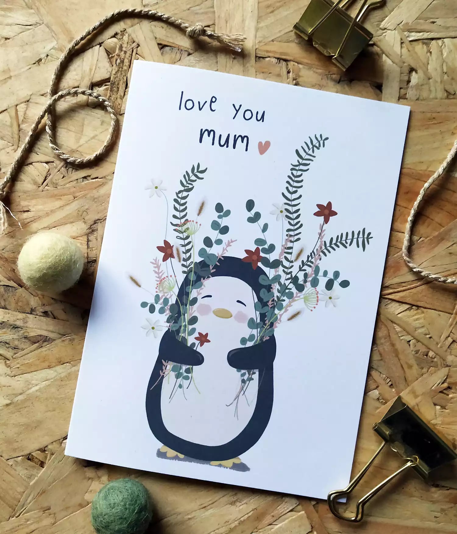 penguin holding flowers and caption 'love you mum'