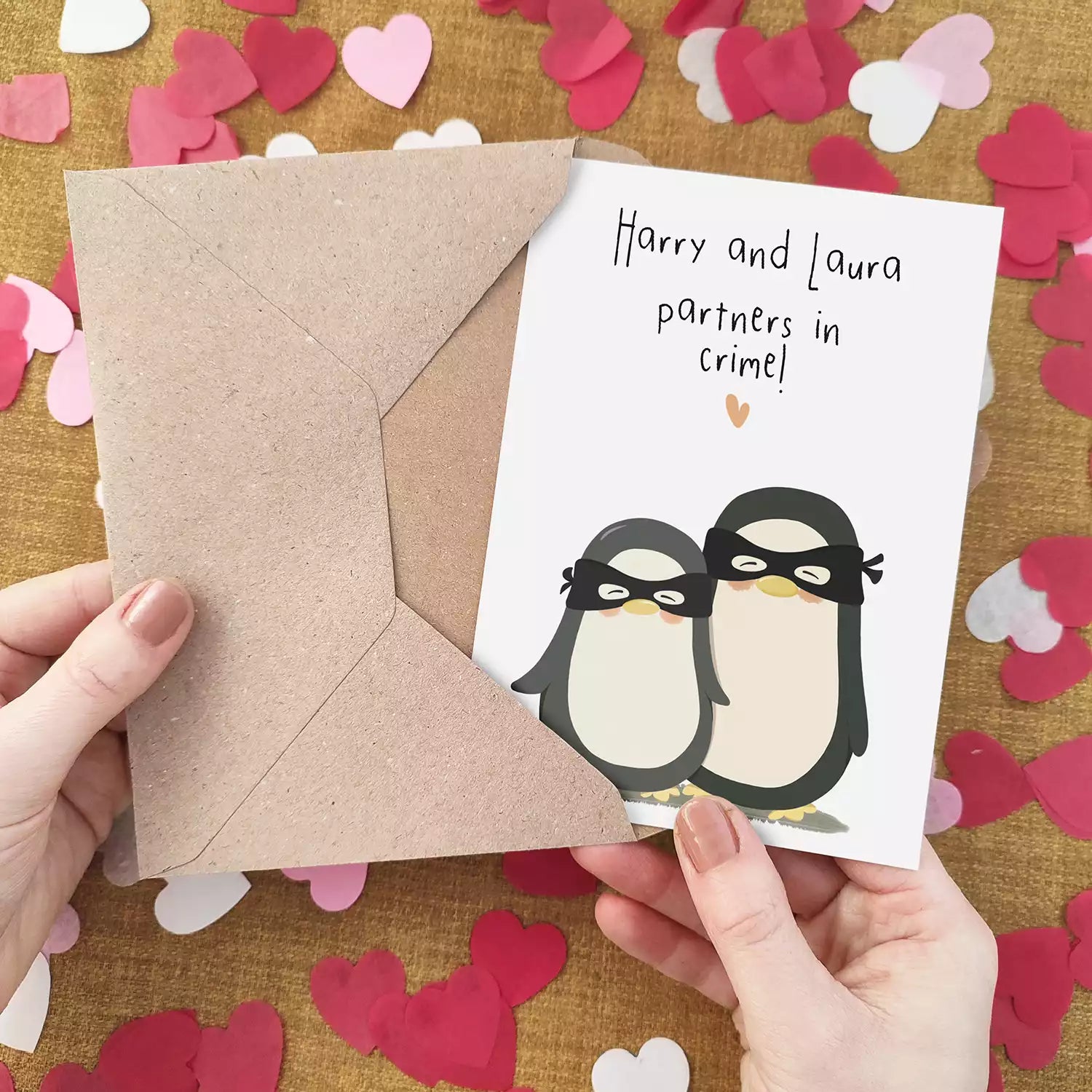 personalised card featuring penguins in burglar masks and text 'partners in crime'