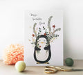 personalised birthday card featuring a penguin holding flowers