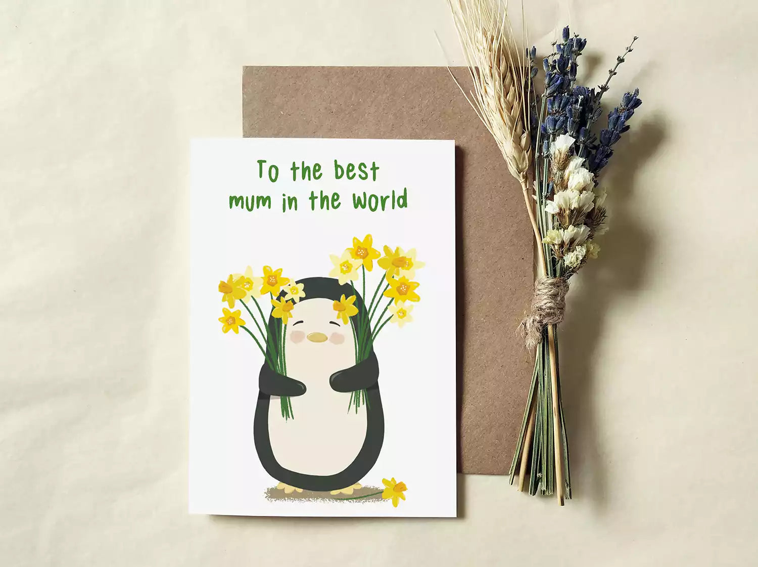 penguin holding daffodils and text 'to the best mum in the world'