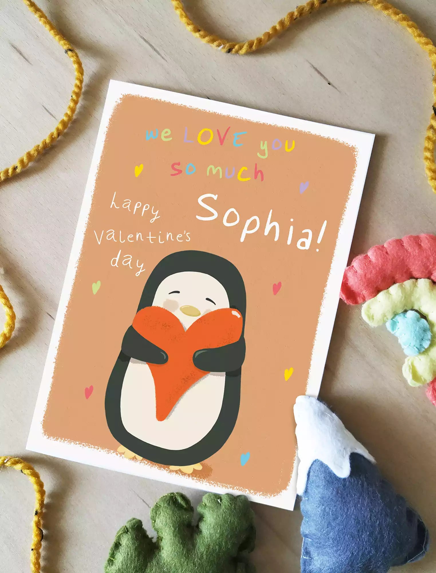 personalised valentines day card from child with a penguin holding a heart