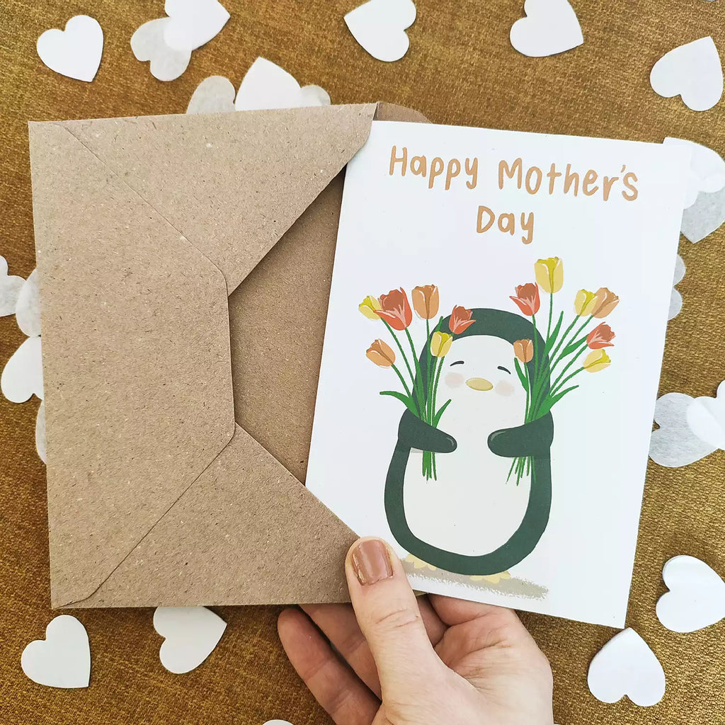 penguin holding tulips and text 'happy mother's day'
