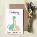 valentines day card with two dinosaurs and pun 'totally roarsome couple'