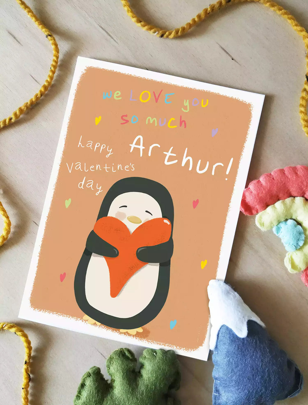 personalised valentines day card from child with a penguin holding a heart